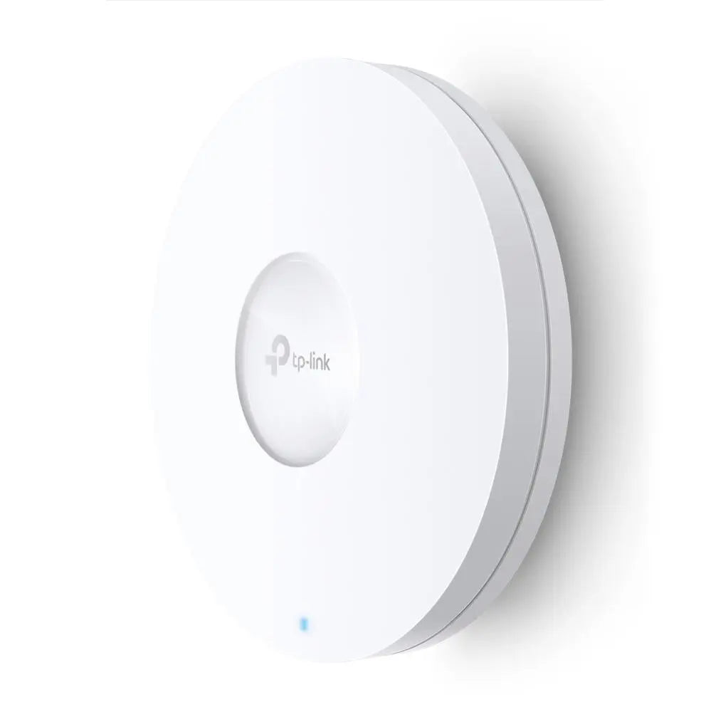TP-Link Omada EAP660 HD AX3600 Access Point mounted on a wall, featuring sleek design and branding.