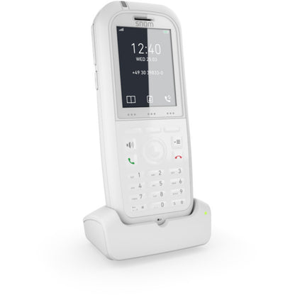 Snom M90 DECT cordless phone in white with charging dock and display features.