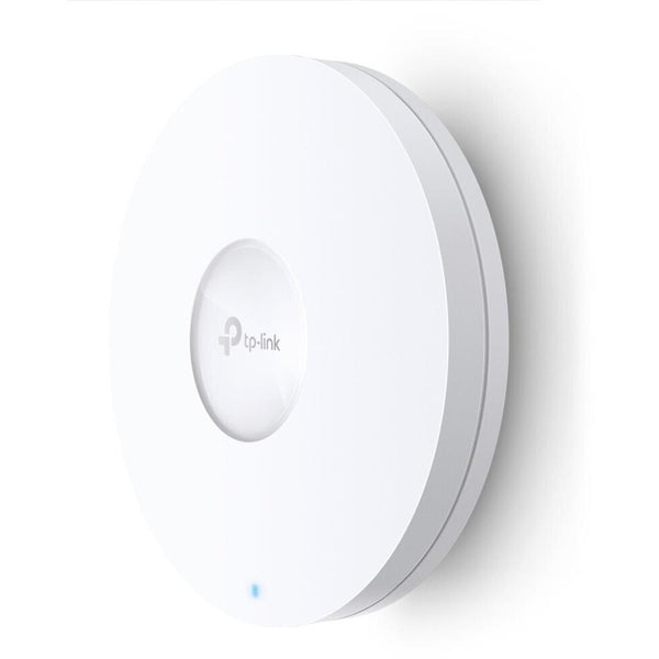 TP-Link EAP620 HD (EU) PoE Wi-Fi 6 Access Point mounted on a wall, showcasing its sleek design.